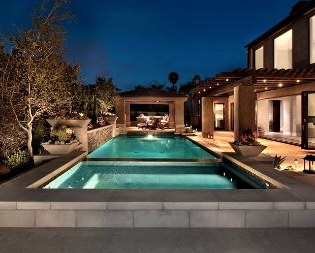 Mid-sized trendy backyard concrete paver and rectangular hot tub photo