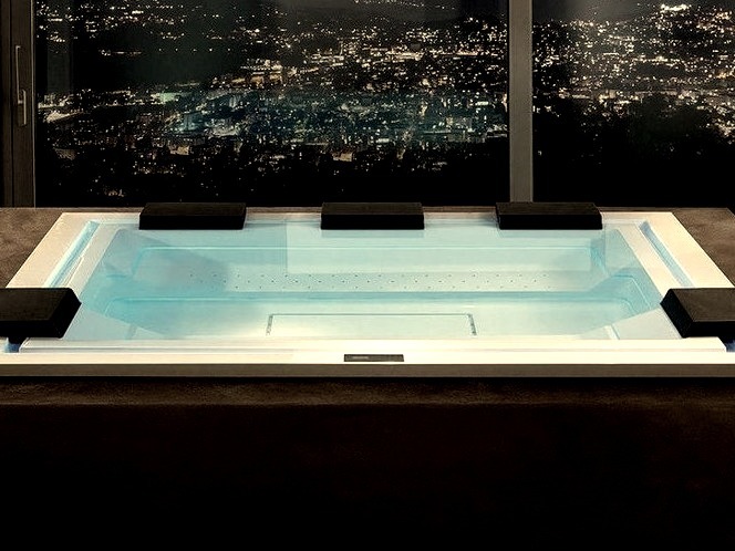large, minimalistic indoor image of an infinity hot tub